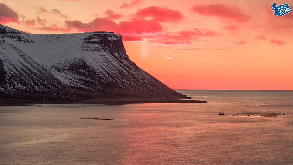 Sunset in Westfjords fishing boat scenery