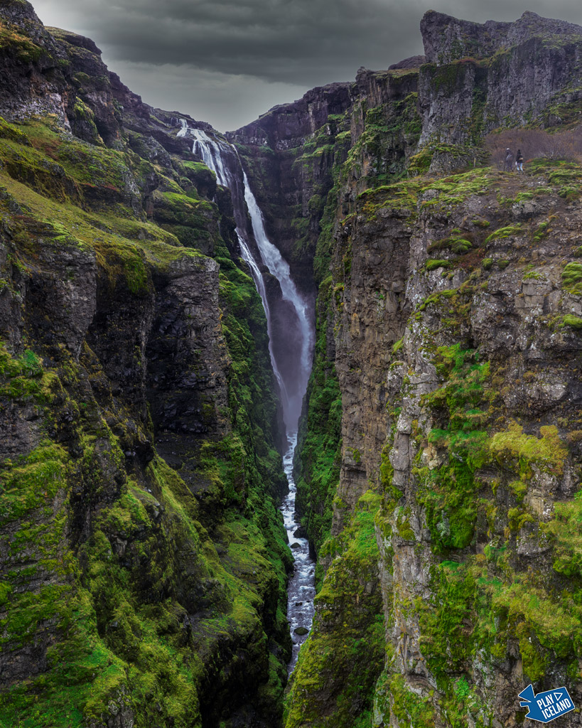 Beautiful deep green lush canyon with Glymur waterfall south Iceland
